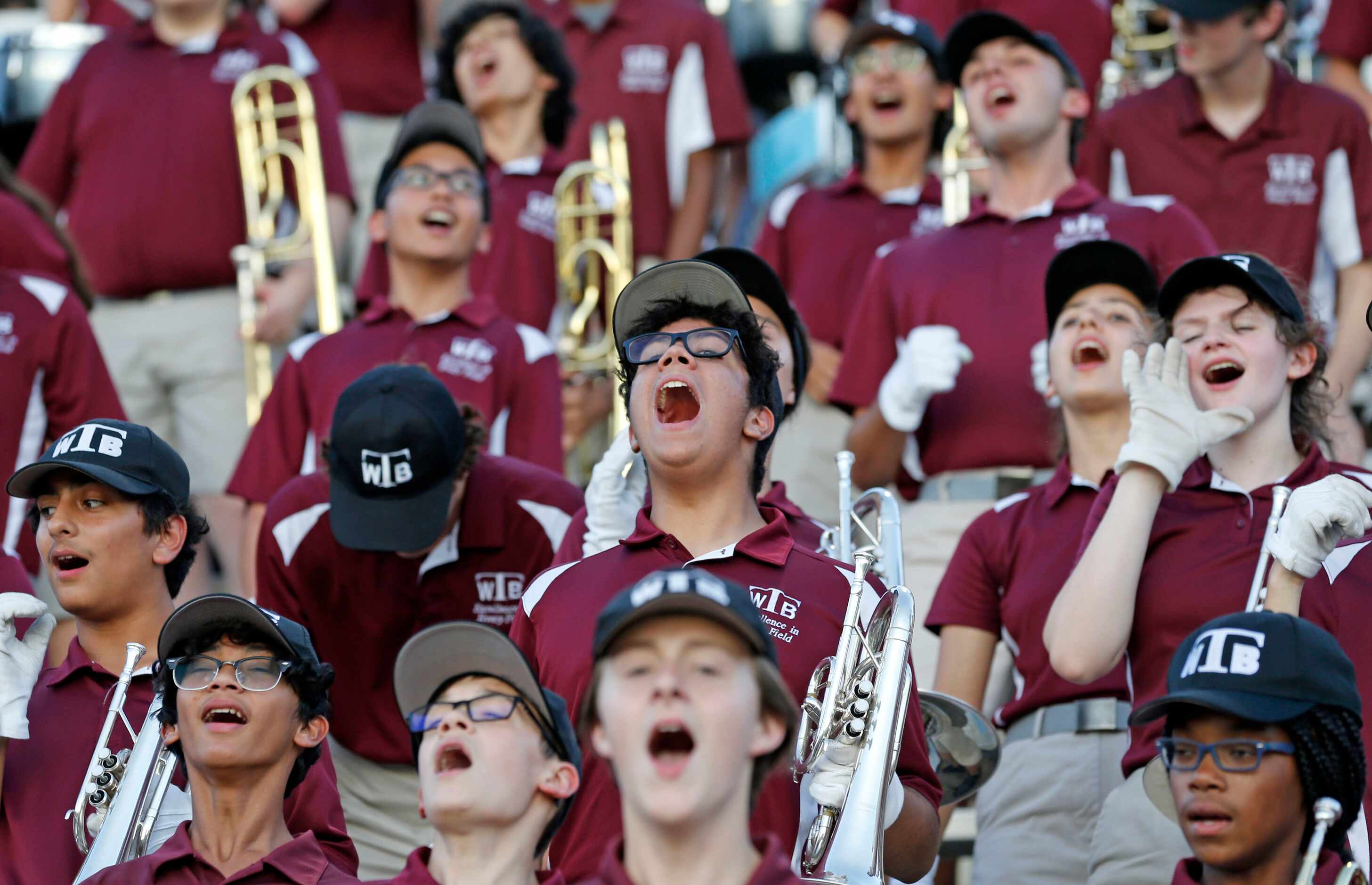 The Wylie High band yells with approval, as the Pirates score another touchdown during the...
