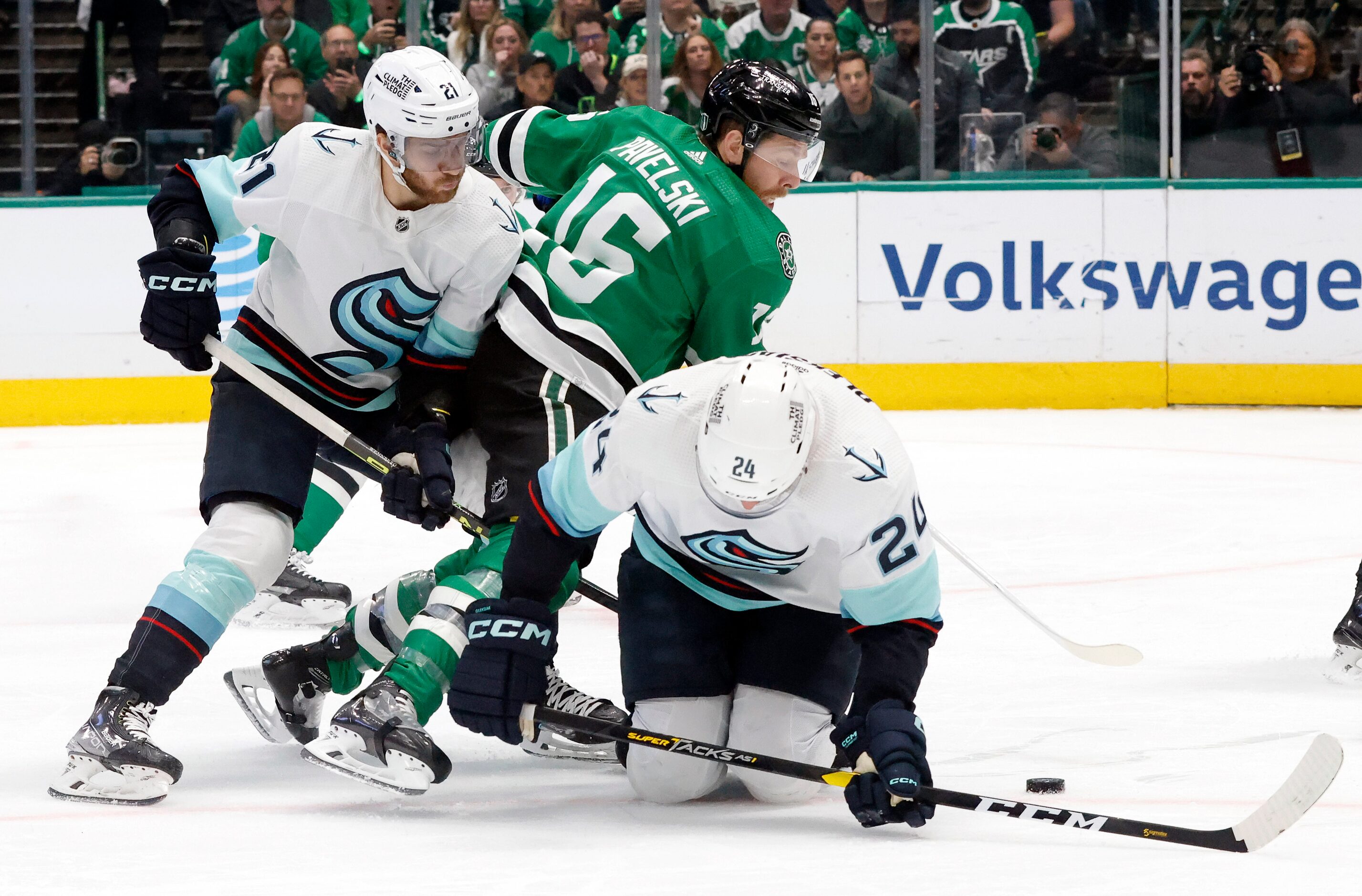 Dallas Stars center Joe Pavelski (16) gets squeezed out by Seattle Kraken center Alex...