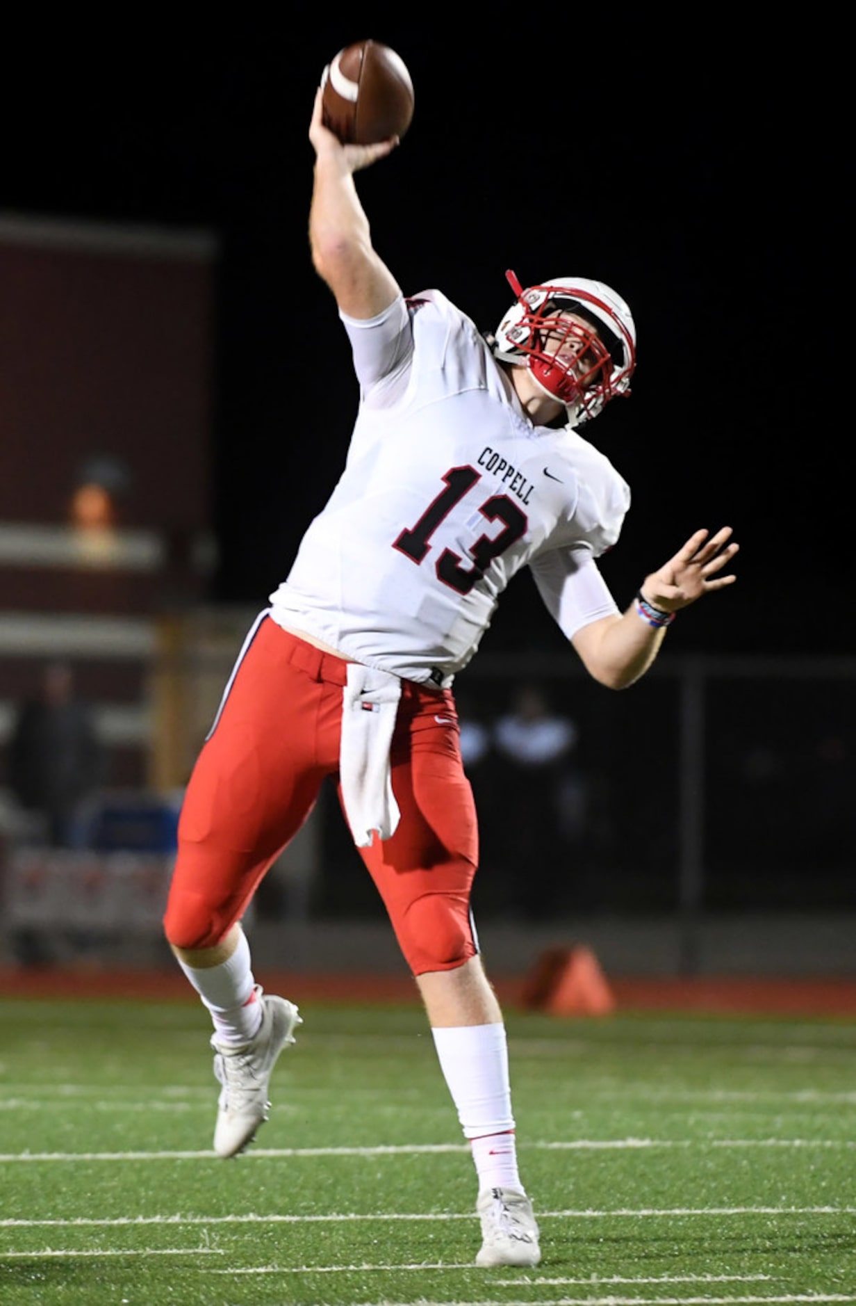 Coppell junior quarterback Drew Cerniglia (13) launches a touchdown pass during the first...