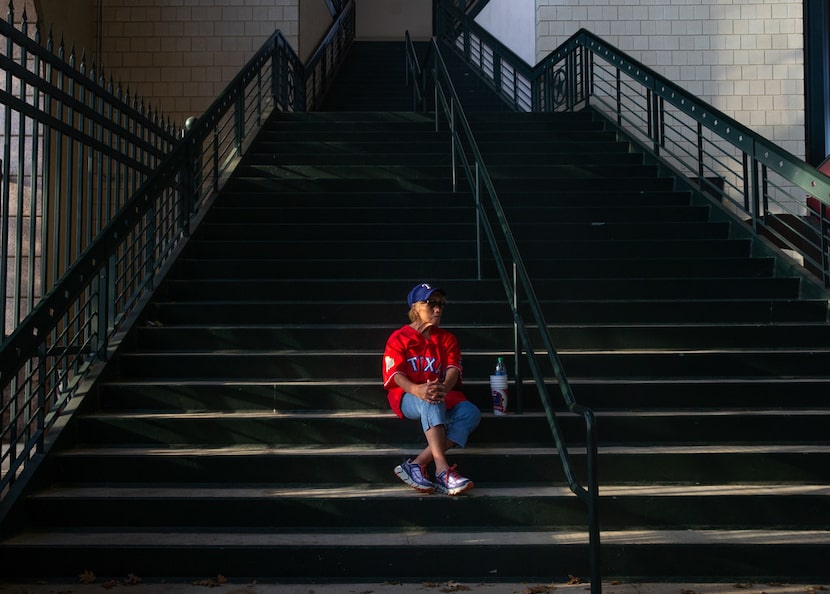 Natalia Delagarza, from Weatherford, Texas, sits on the staircase near the exit of Globe...