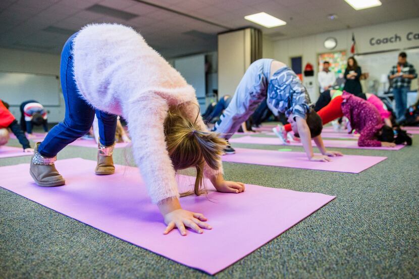 In yoga class at Frisco ISD's Pink Elementary School, students are taught breathing...