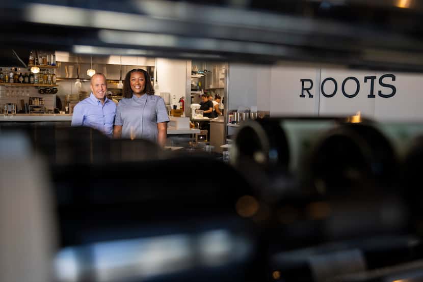 Tom Foley (left) and chef Tiffany Derry pose for a photo at Roots Southern Kitchen in...