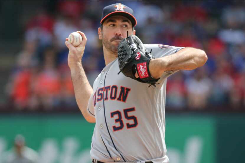 Houston Astros starting pitcher Justin Verlander (35) throws a first-inning pitch during the...