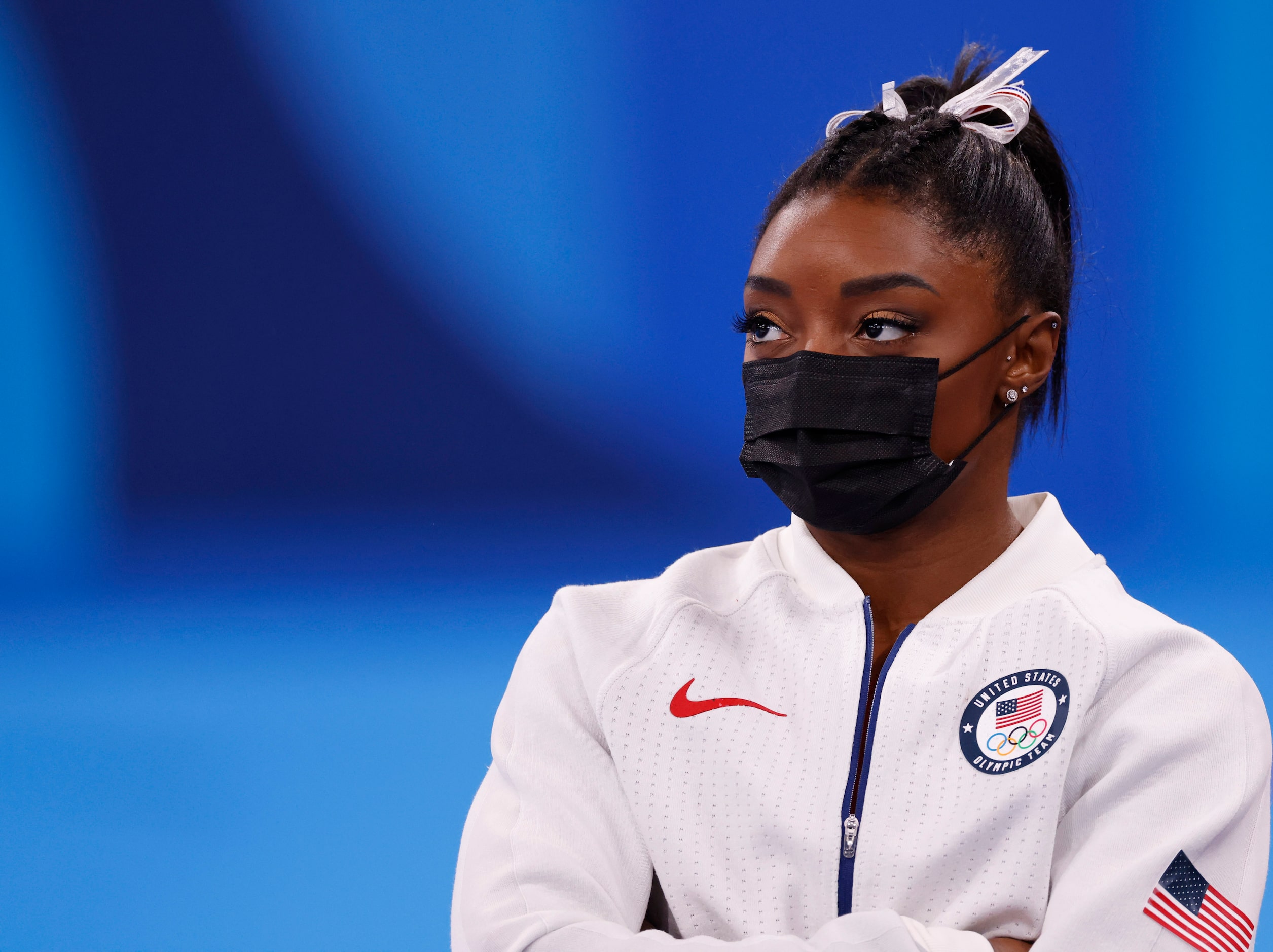 USA’s Simone Biles watches after pulling out of the competition after the vault event during...