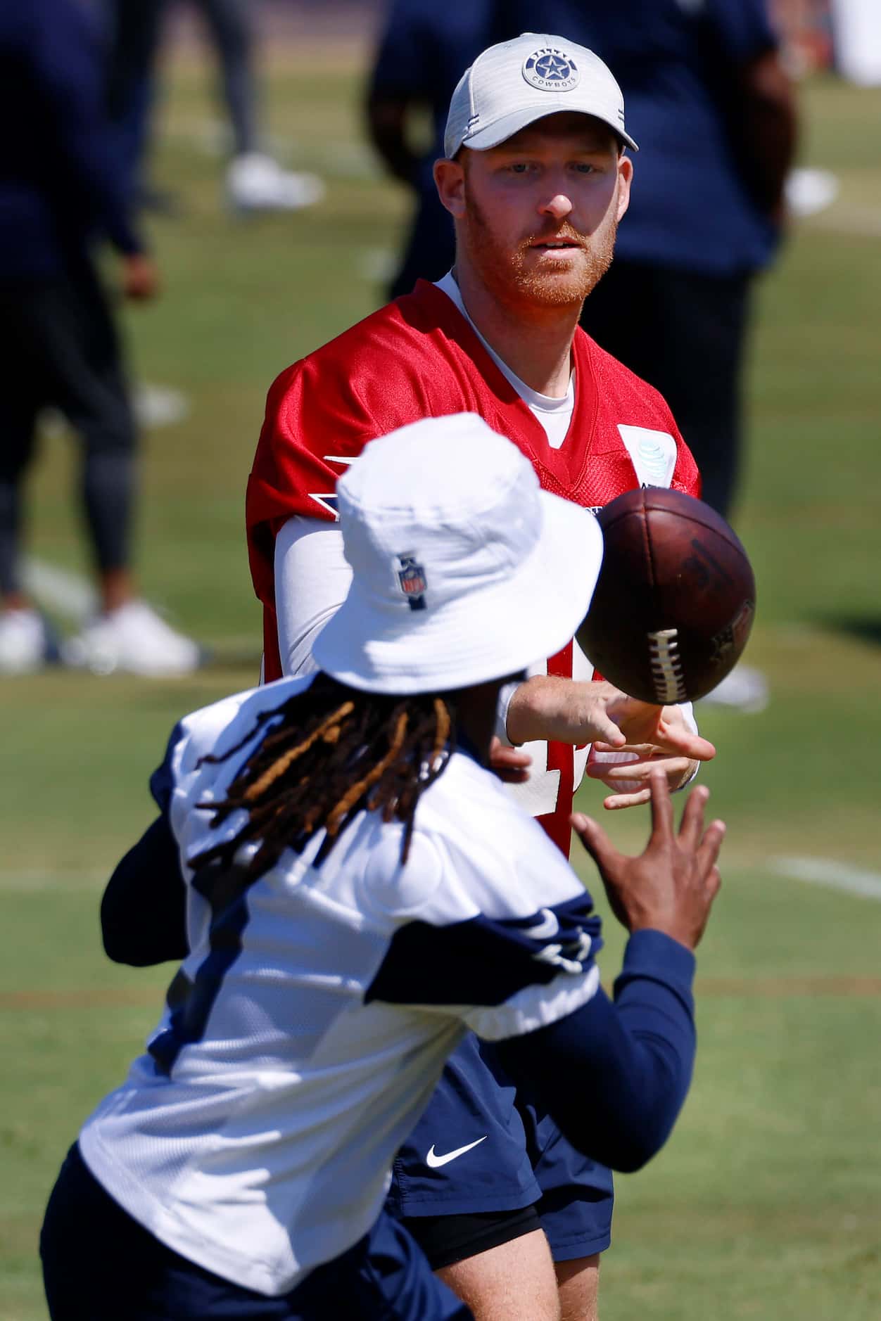 Dallas Cowboys quarterback Cooper Rush (10) pitches the ball wide receiver KaVontae Turpin...
