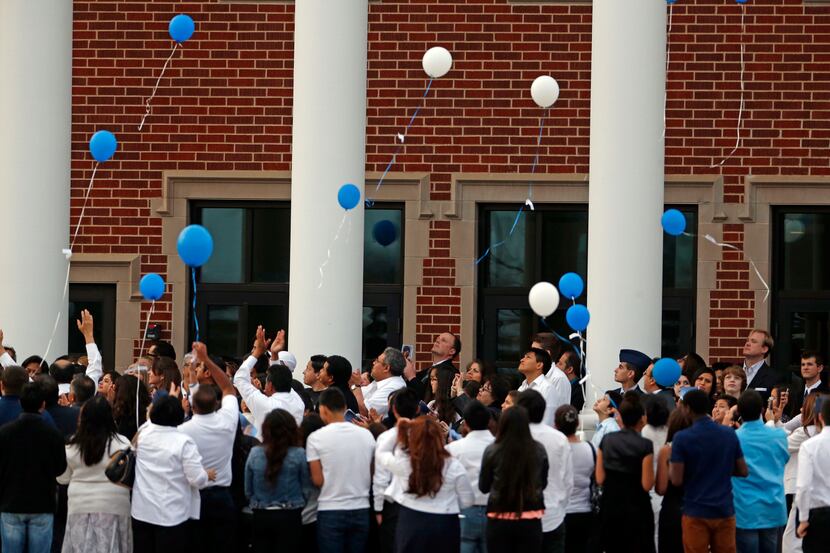 Mourners release memorial balloons after they attended the funeral of 17-year-old Ivan...