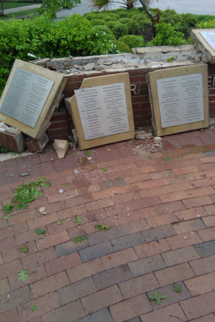 The garden wall, where names in memory are listed, was demolished in an accident on April...