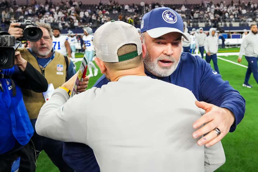 Dallas Cowboys head coach Mike McCarthy hugs Green Bay Packers head coach Matt LaFleur after...