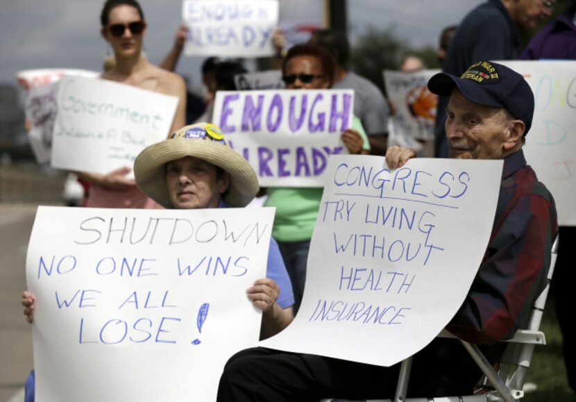 Susan Cooper, left, of Richardson, Texas, sits with her husband, Jack, 93, a World War II...