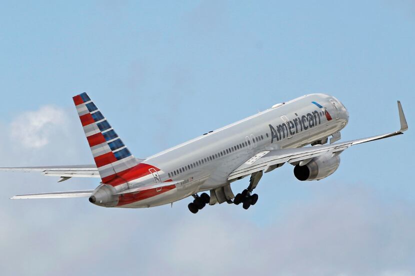 FILE - In this 2016 file photo, an American Airlines passenger jet takes off from Miami...