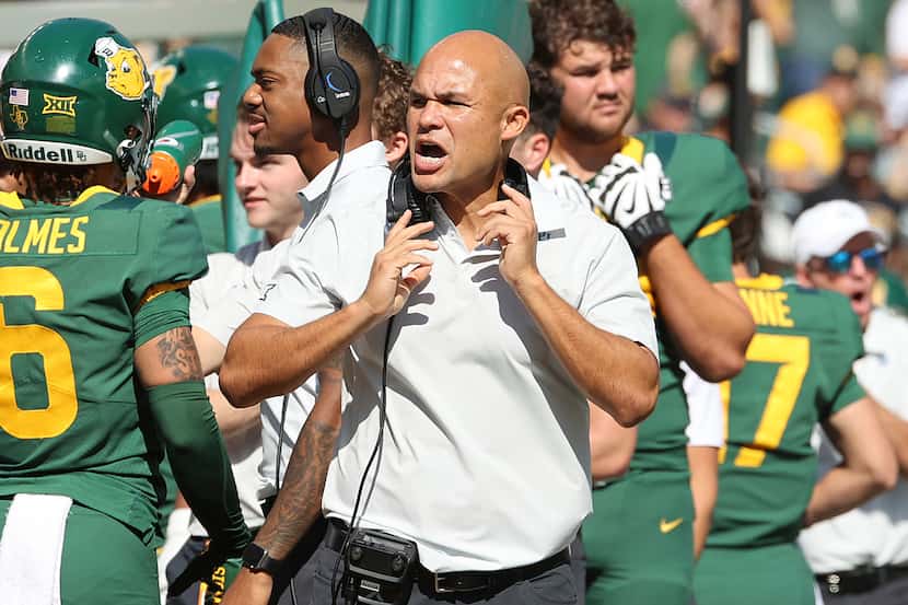 Baylor head coach Dave Aranda reacts after the team scored against Kansas in the first half...