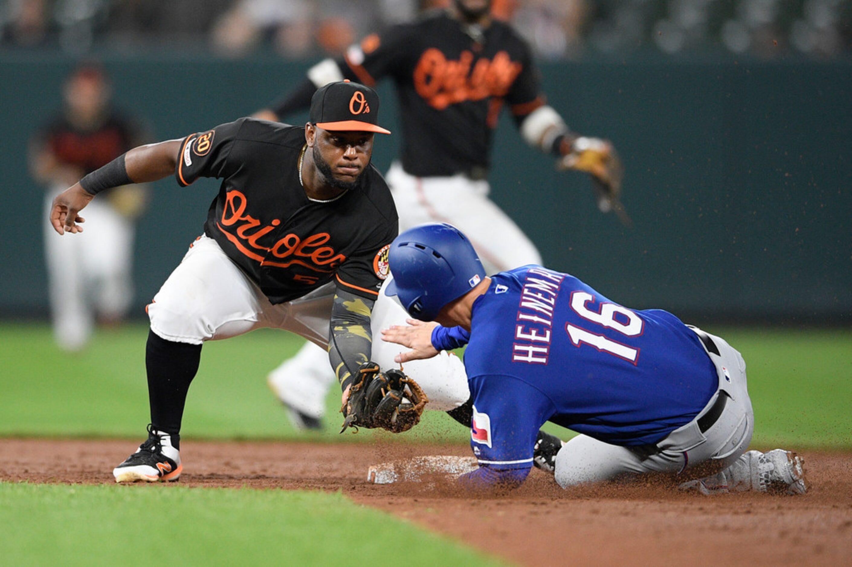 Texas Rangers' Scott Heineman (16) is caught while attempting to steal second base against...