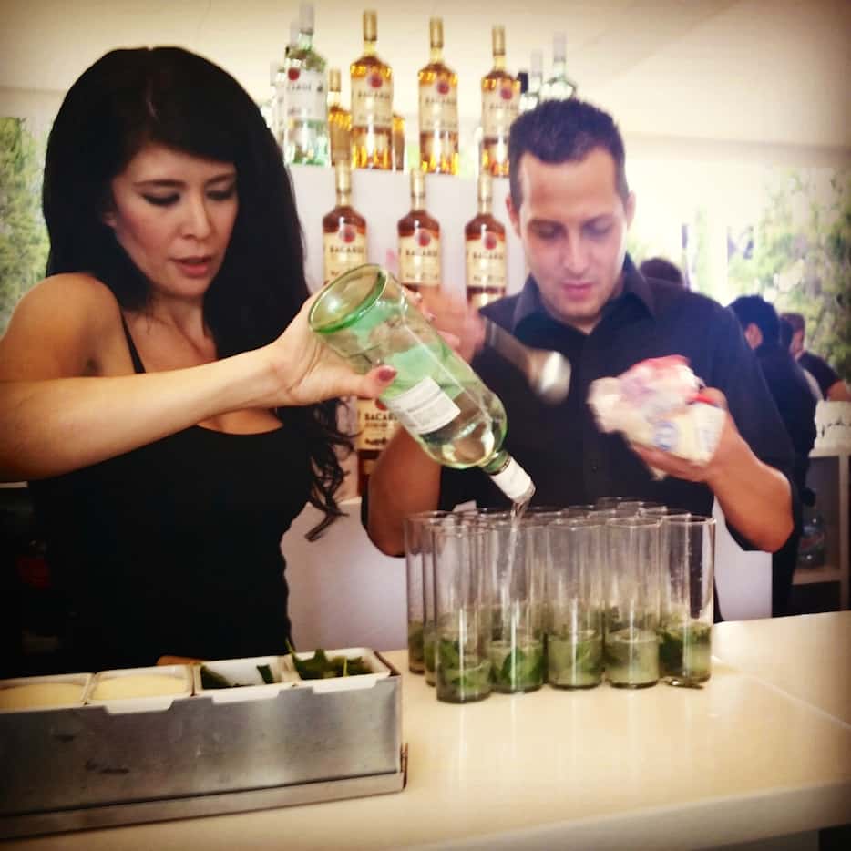 The Bacardi crew, cranking out an assembly line of mojitos before the walking tour.