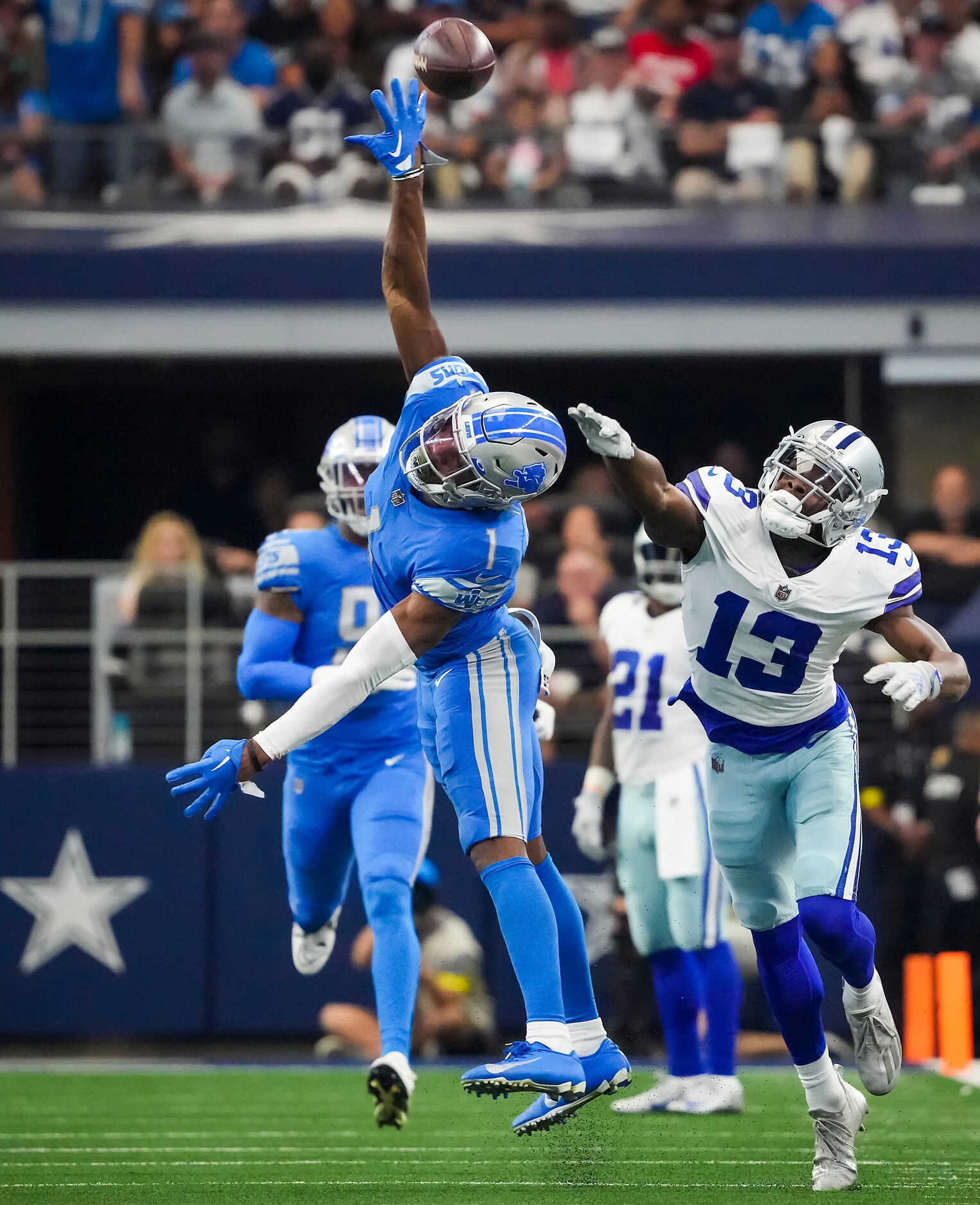 A pass from Dallas Cowboys quarterback Dak Prescott sails over the head of wide receiver...