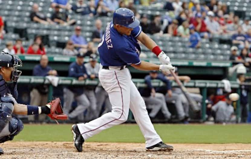 09/13/2009 -- Texas Rangers catcher Ivan Rodriguez connects with the ball during a 7-2 win...