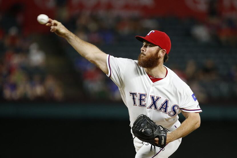Rangers relief pitcher Sam Dyson (47) throws a pitch against Orioles during the 9th inning...