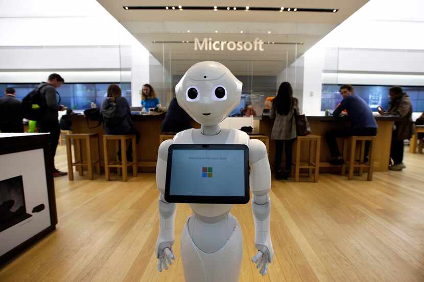 In this March 21, 2019, file photo a robot called "Pepper" is positioned near an entrance to...