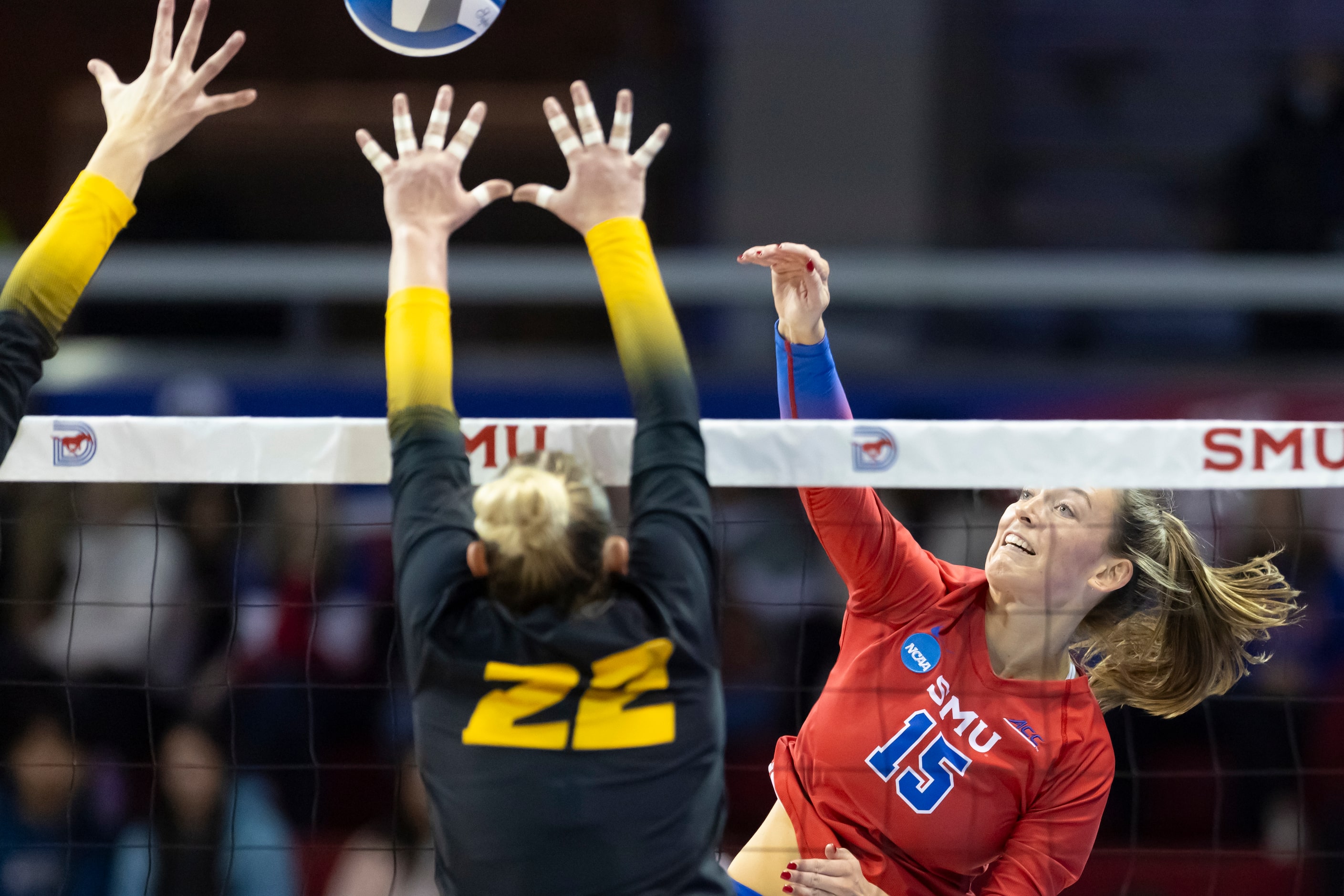 SMU’s Jamison Wheeler (15) spikes the ball as Missouri’s Marina Crownover (22) attempts to...