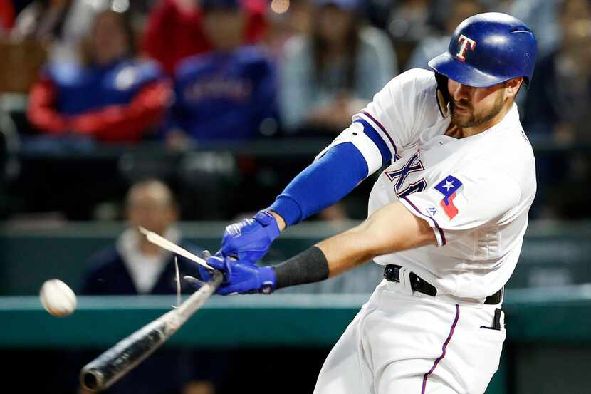 Texas Rangers slugger Joey Gallo (13) breaks his bat on a fifth-inning swing against the Los...