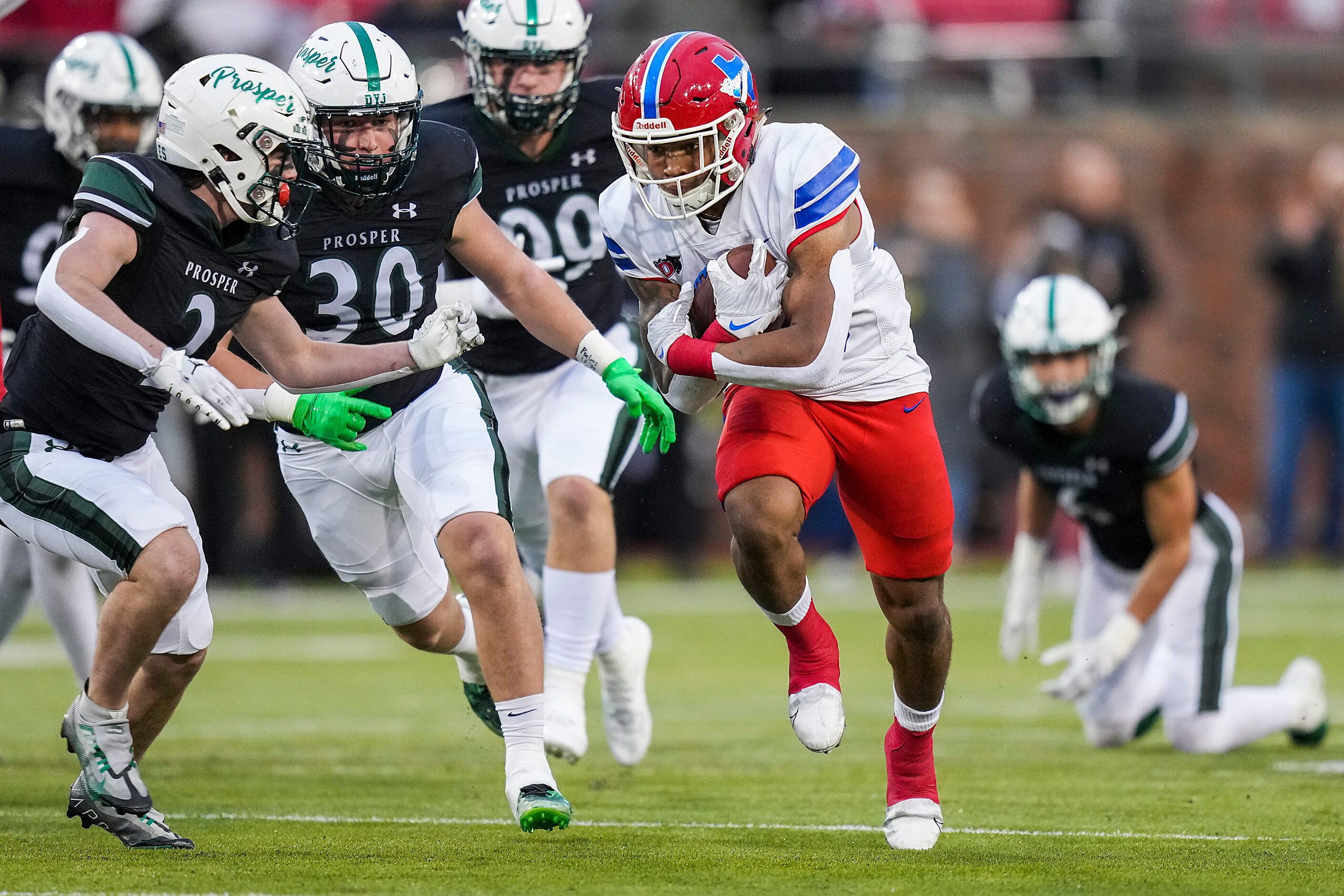 Duncanville running back Caden Durham (29) gets past Prosper defensive back Carson McClendon...