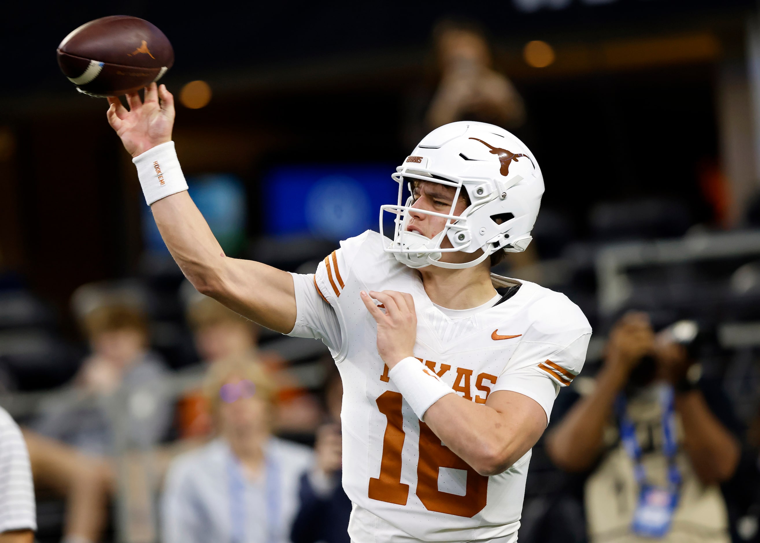 Texas Longhorns quarterback Arch Manning (16) warms up his arm during pregame workouts...