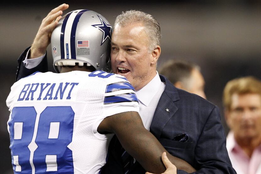 Dallas Cowboys executive vice president Stephen Jones hugs Dallas Cowboys wide receiver Dez...