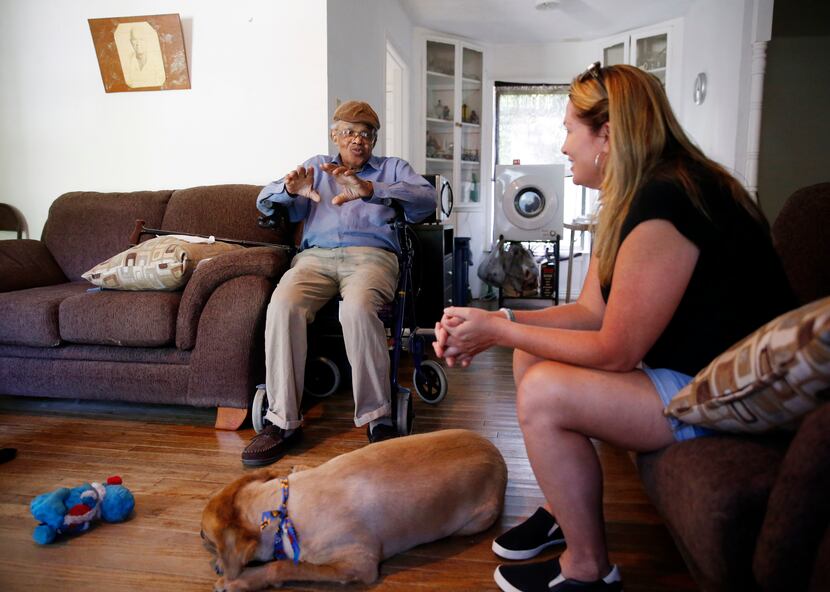 James Evans, 83, talks with Jeanne Marie Boyne (right), a volunteer for the Seniors' Pet...
