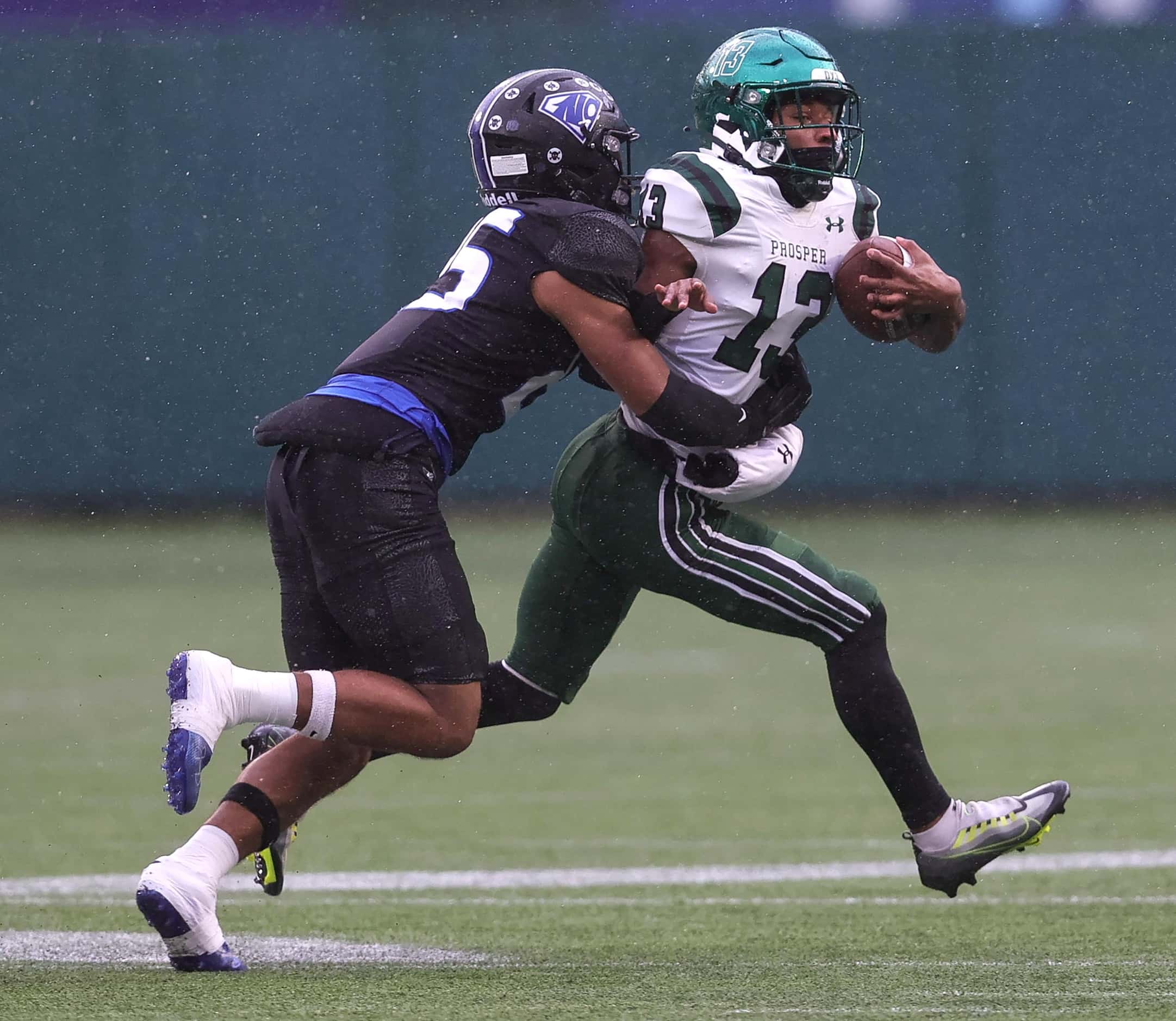 Prosper wide receiver Prentice Sanders (13) tries to break away from North Crowley safety...
