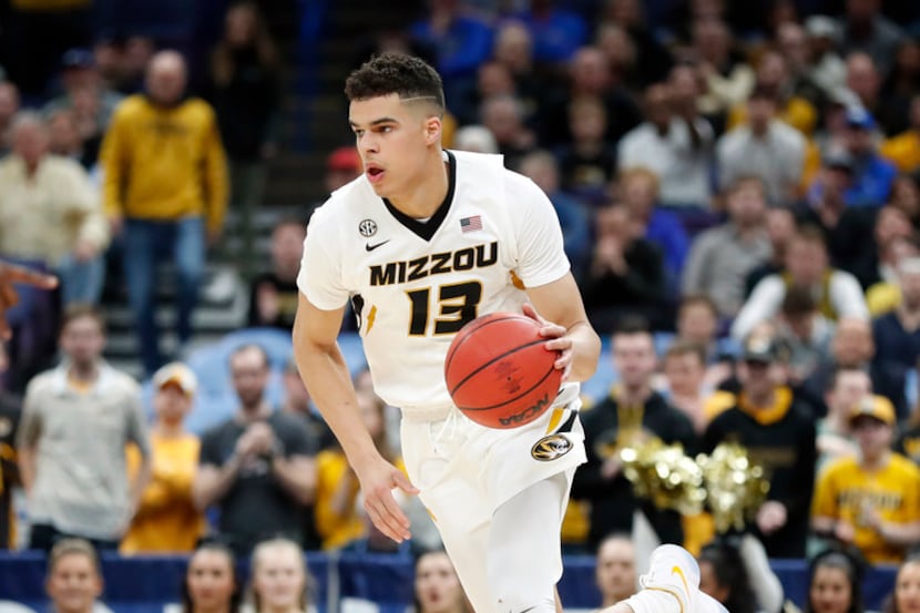 Missouri's Michael Porter Jr. brings the ball down the court during the first half in an...