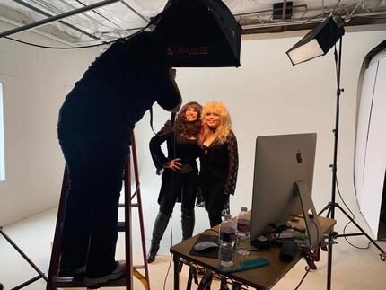 Two women pose for photographer Debra Gloria in her studio.