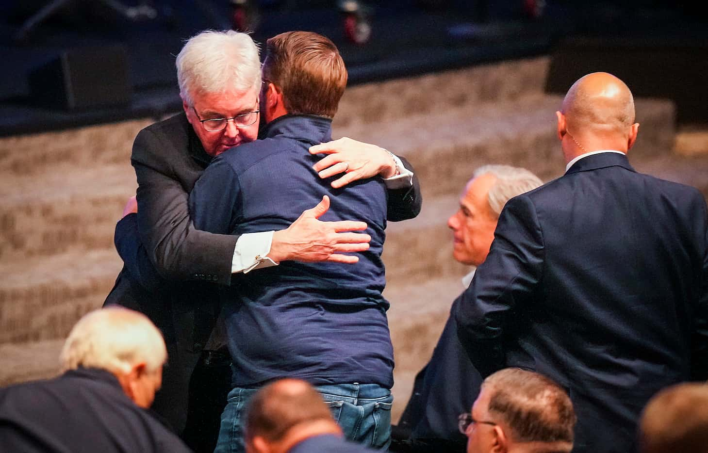 Texas Lt. Gov. Dan Patrick (facing) hugs a man after a vigil at Cottonwood Creek Church a...