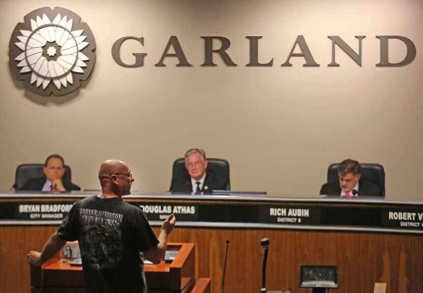 Garland resident Steve Nelson talks during a public hearing at the city hall in Garland....