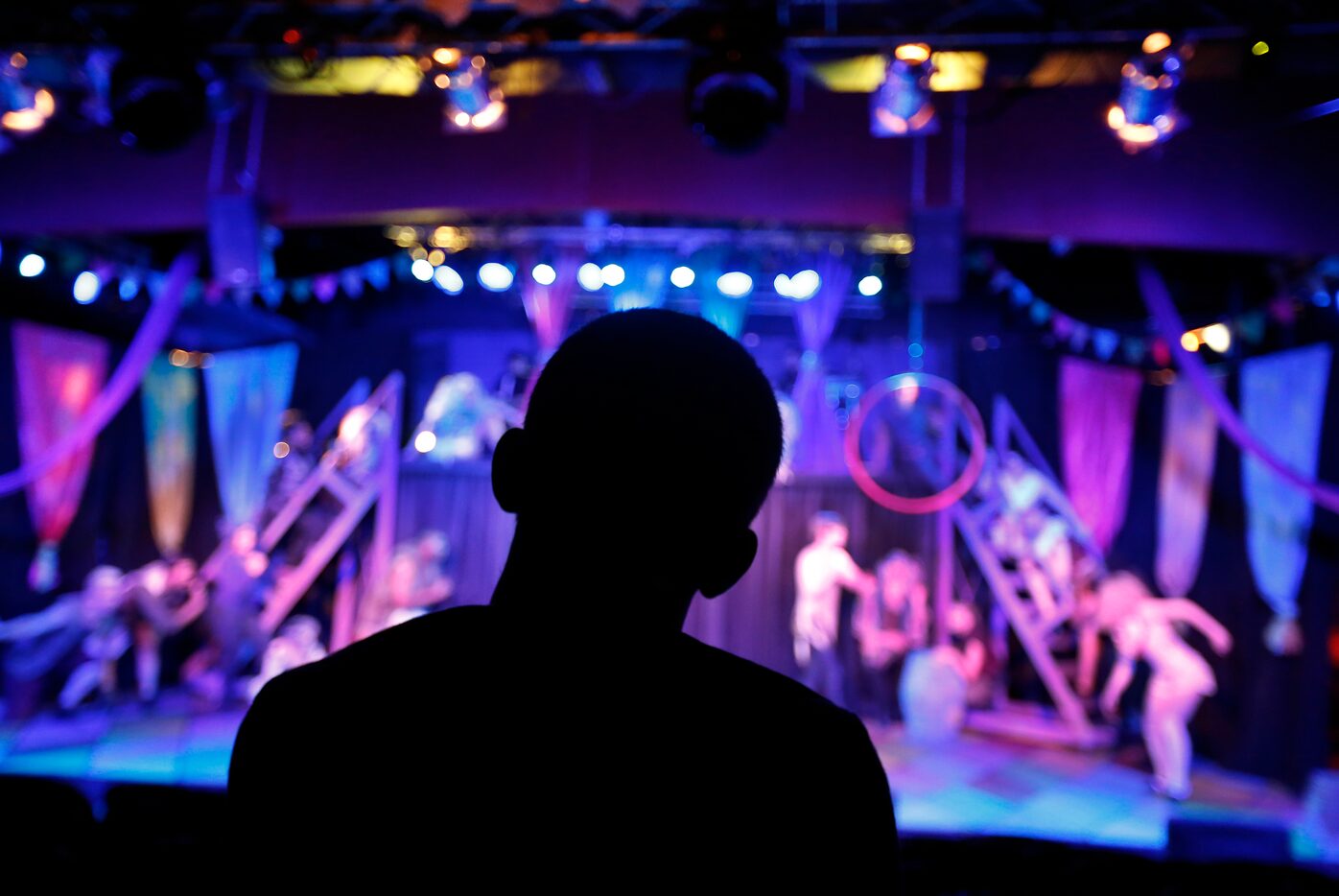 Director Derek Whitener watches his actors perform the first act of Pippin during a dress...