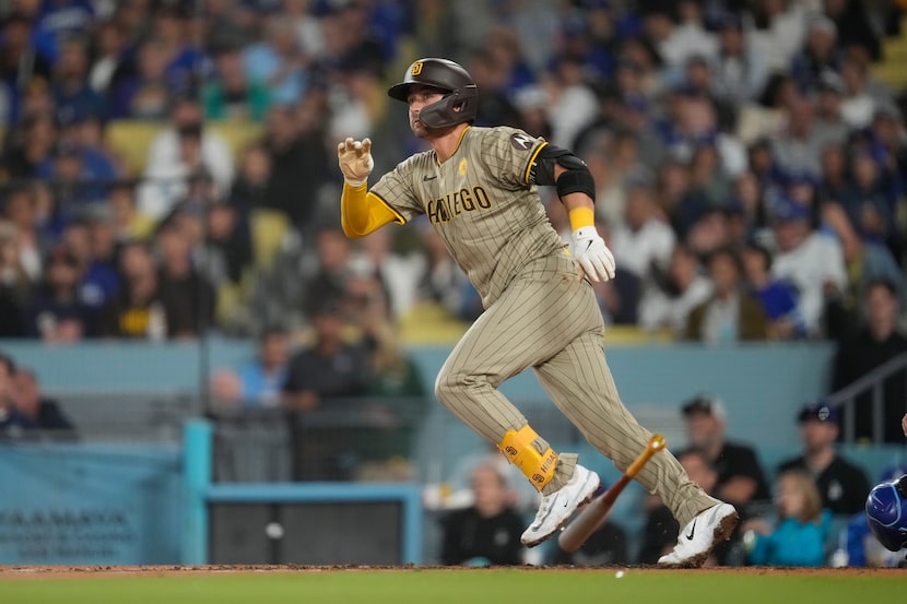 San Diego Padres' Kyle Higashioka watches his ground rule double during the fifth inning of...