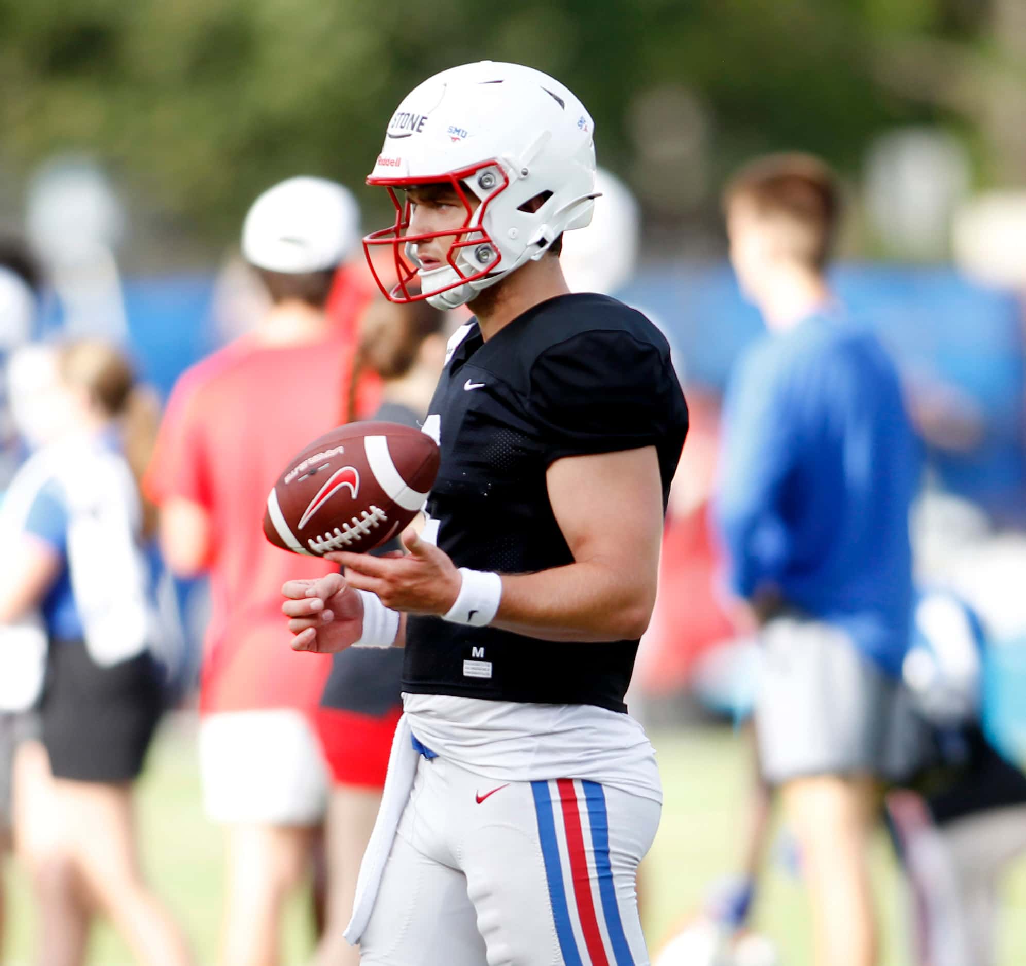 SMU Mustangs starting quarterback Preston Stone (2), completes a passing drill during a team...