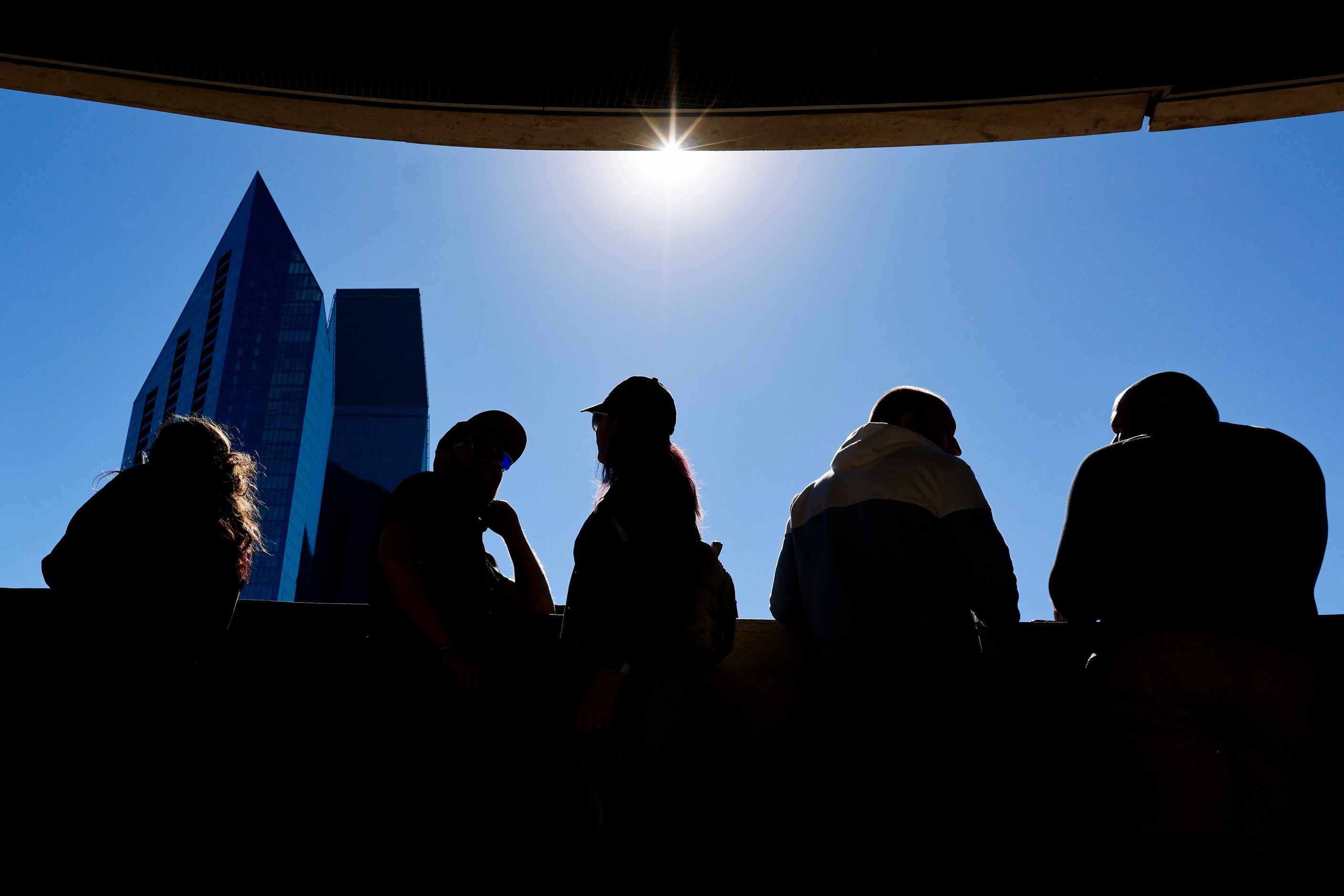 People gather to watch the annular solar eclipse on Saturday, Oct. 14, 2023, at Perot Museum...
