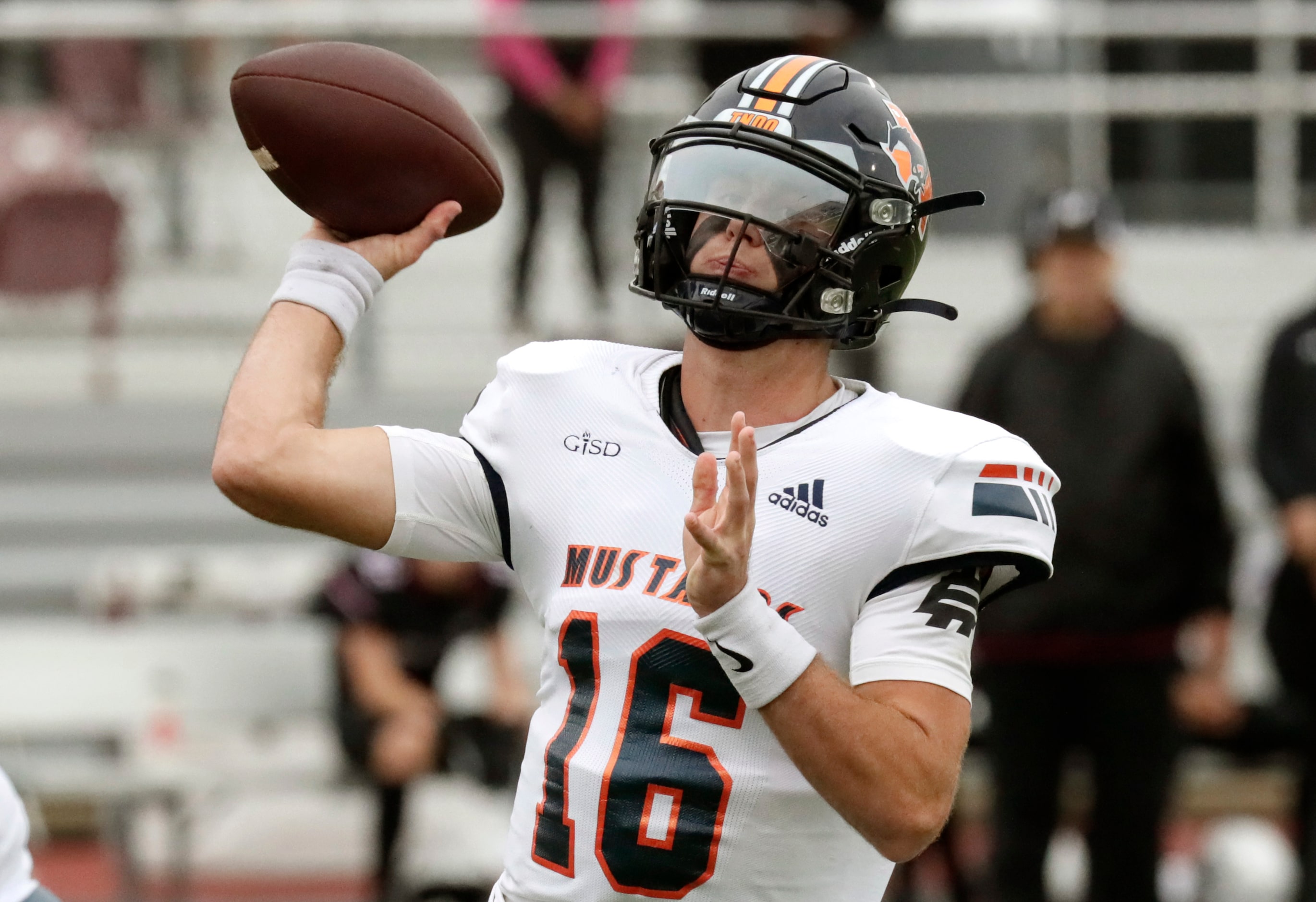 Sachse High School quarterback Brenden George (16) throws a touchdown pass during the second...