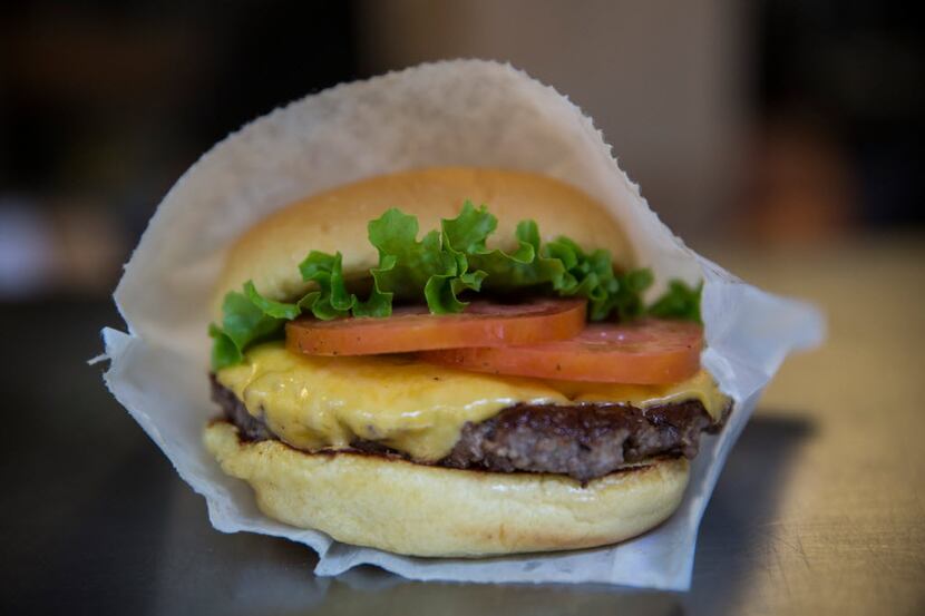 A Shake Shack burger. NEW YORK, NY - AUGUST 18: A Shake Shack burger is displayed on August...