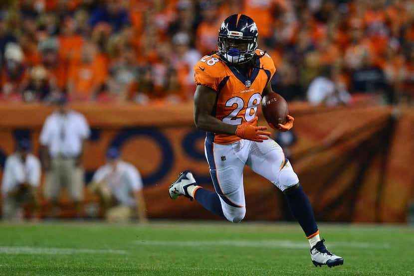 DENVER, CO - SEPTEMBER 11:  Running back Jamaal Charles #28 of the Denver Broncos rushes for...