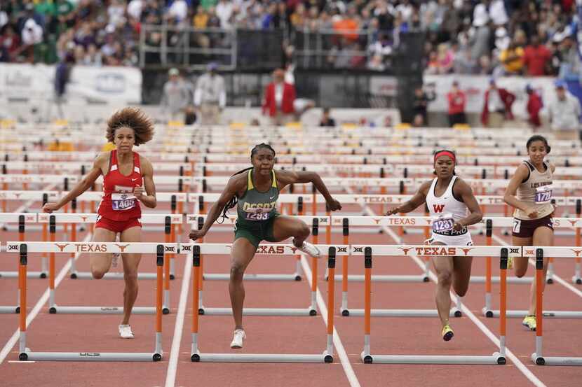 Desoto's Jayla Hollis (1293) takes first place in the girls 6A 100-meter hurdles with a...