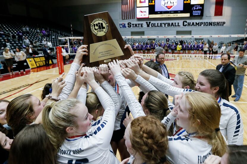 Flower Mound celebrates winning the Class 6A volleyball state championship match against...
