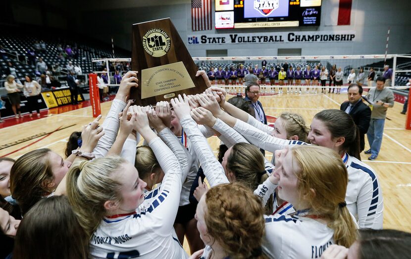 Flower Mound celebrates winning the Class 6A volleyball state championship match against...