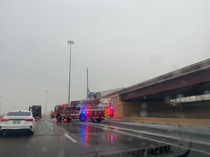 A fire truck is seen at the scene of an accident at State Highway 183 in Irving on January...