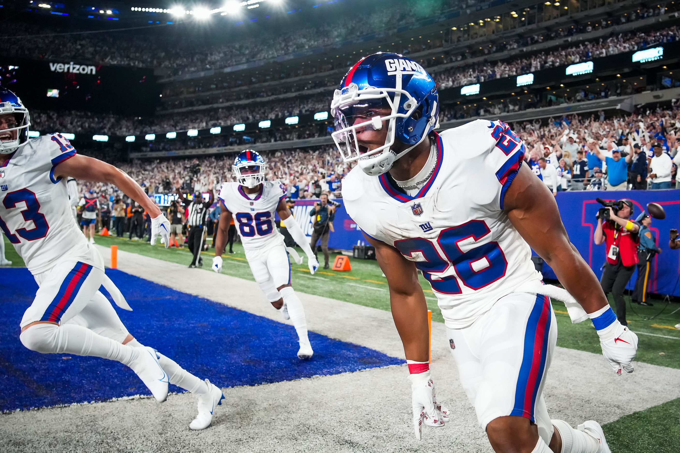 New York Giants running back Saquon Barkley (26) celebrates after scoring on a touchdown ...