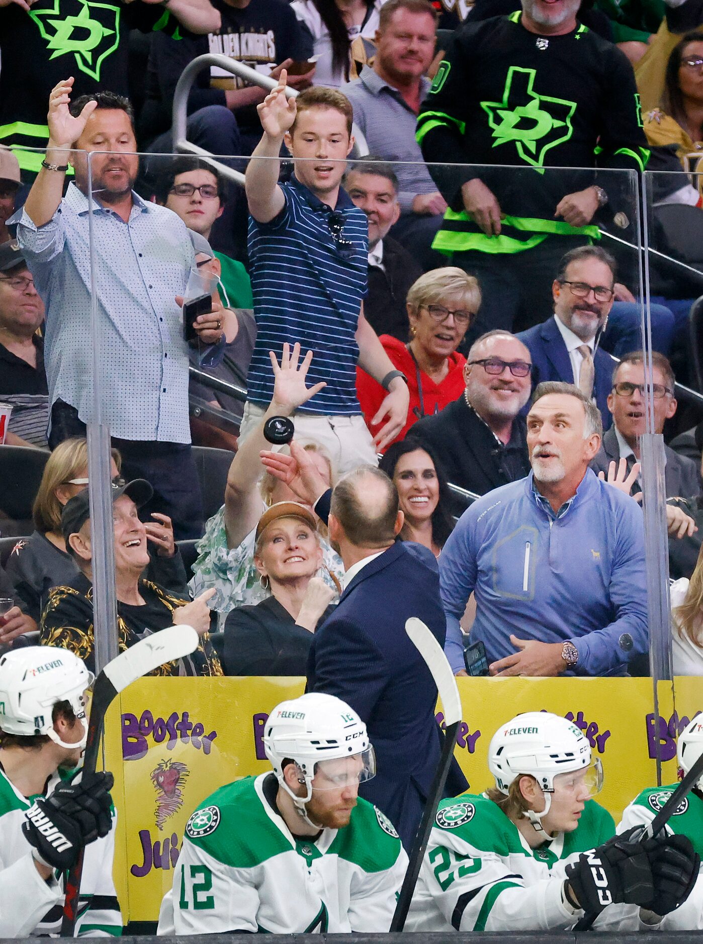 Dallas Stars head coach Peter DeBoer caught an errant puck and tossed it to fans during the...