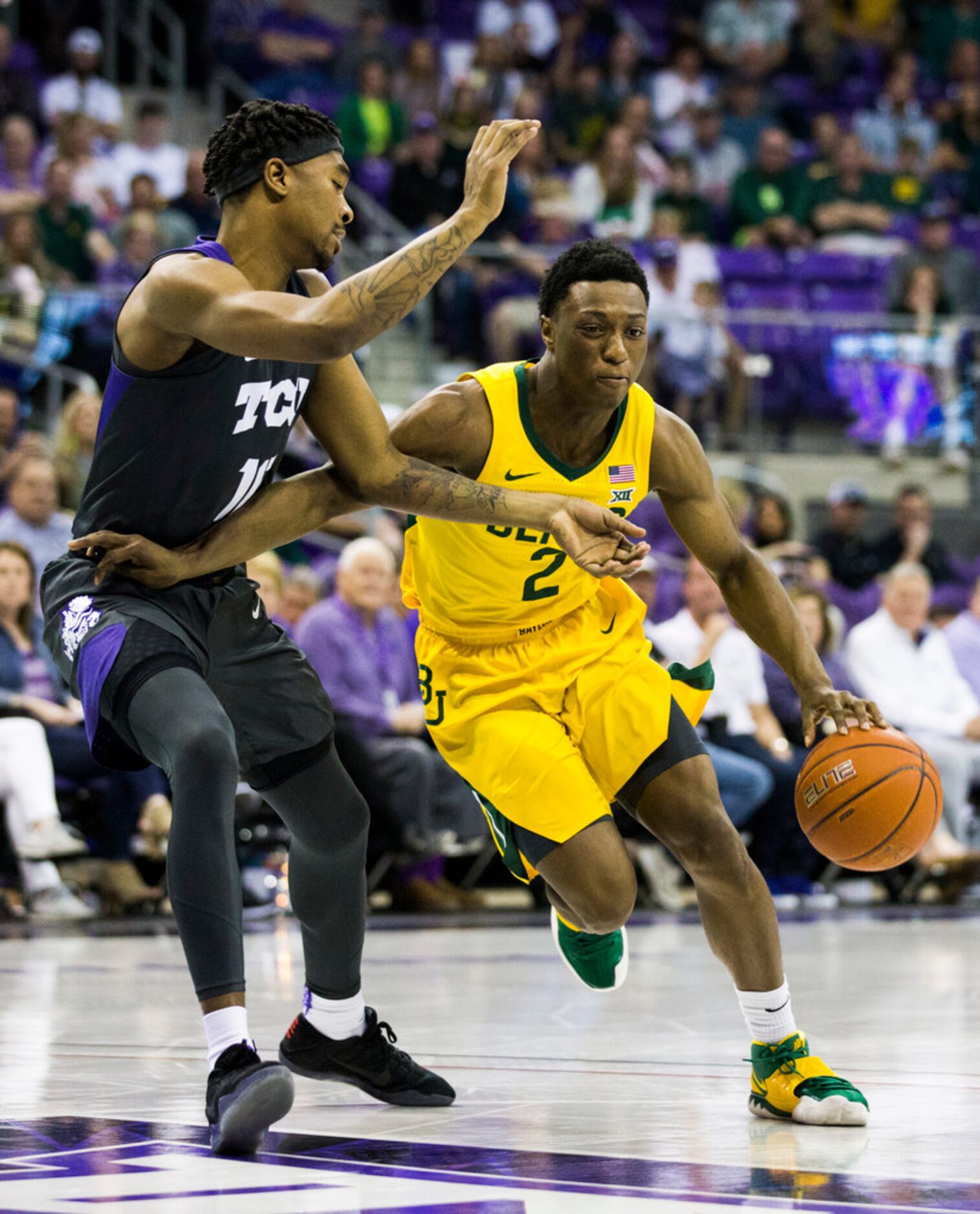 Baylor Bears guard Devonte Bandoo (2) gets around TCU Horned Frogs forward Diante Smith (10)...