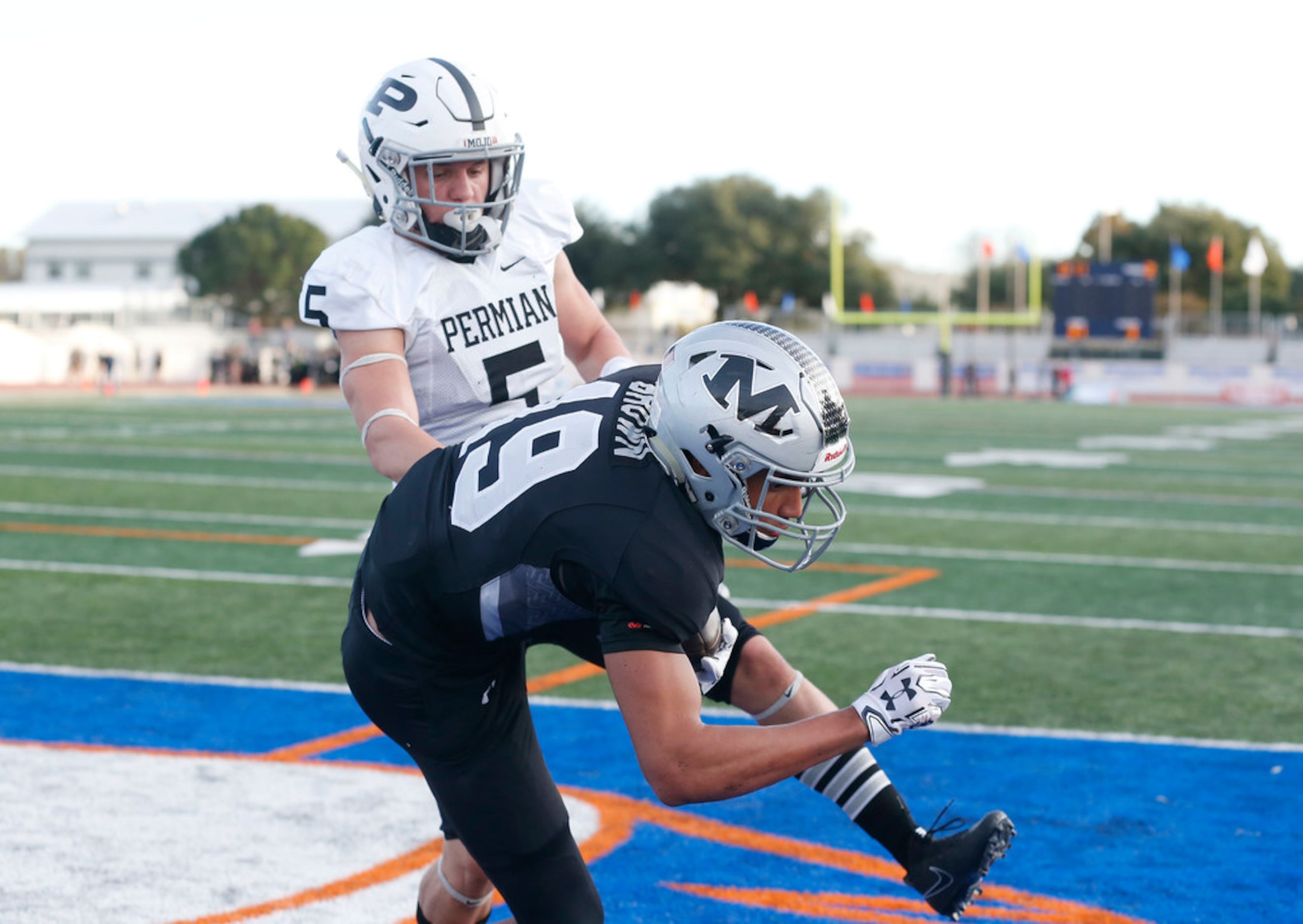 Odessa Permian cornerback Christian Tschauner (5) watches as Arlington Martin receiver...