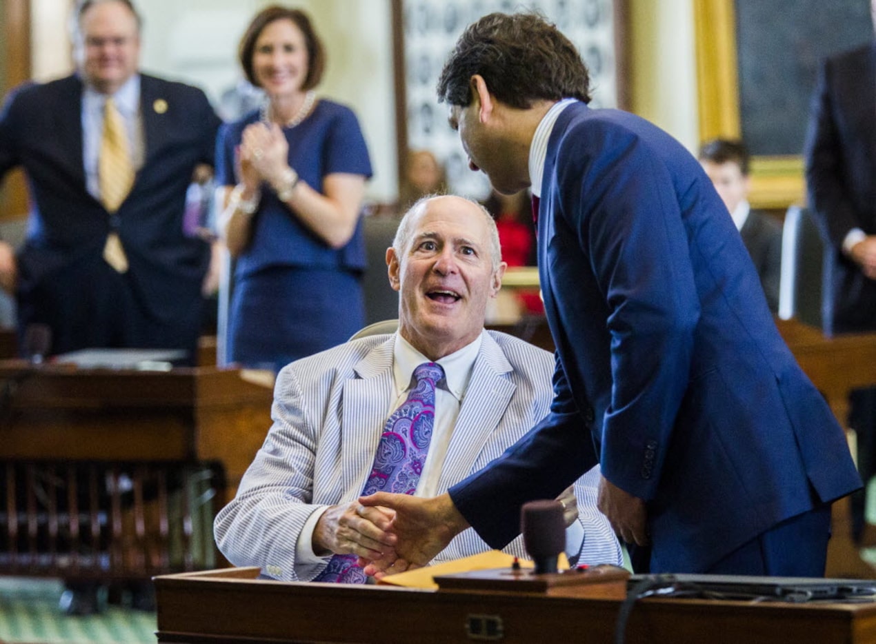 Sen. Kel Seliger, R-Amarillo, congratulates Sen. Kevin P. Eltife, R-Tyler (right) on his...