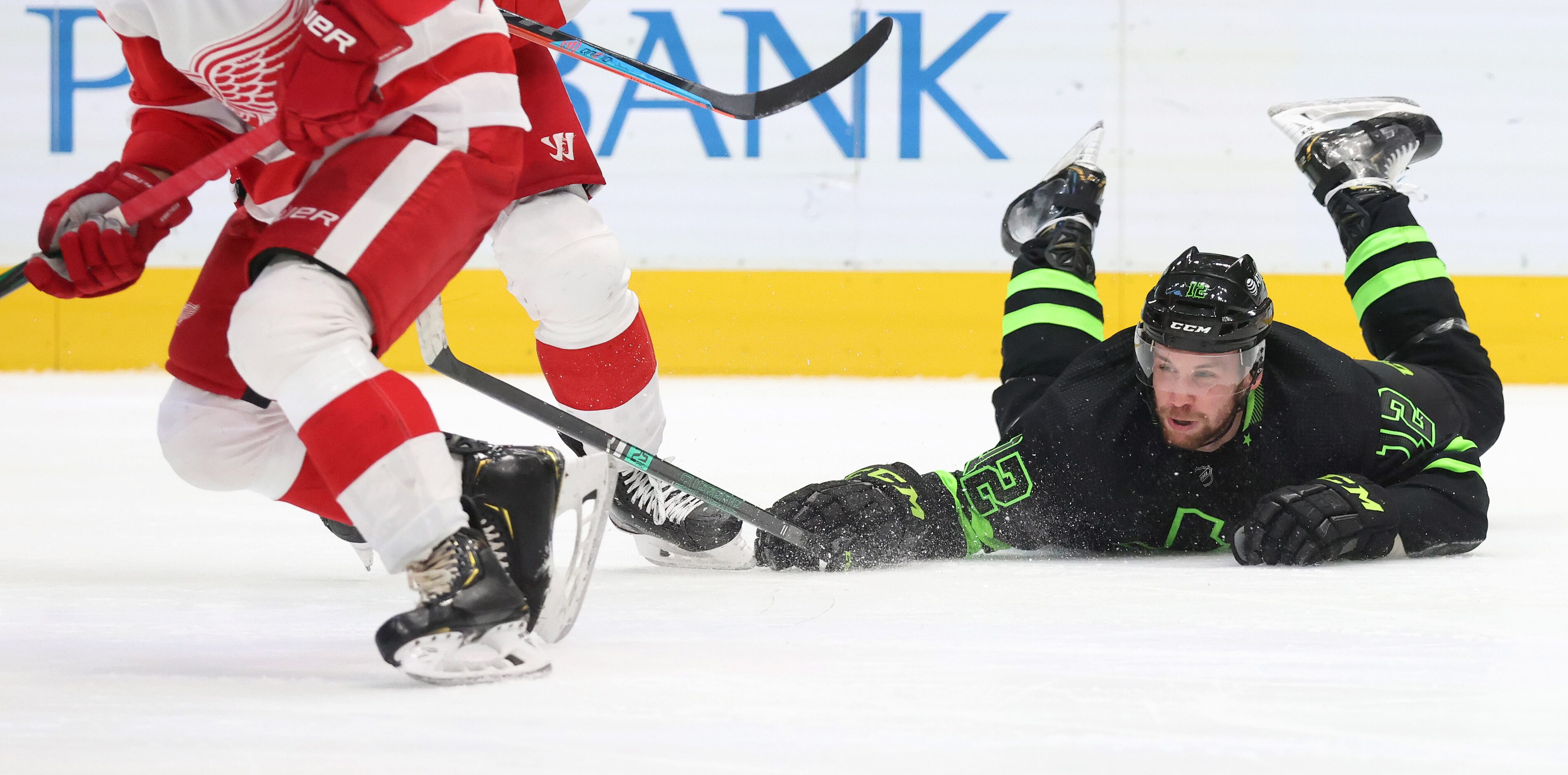 Dallas Stars center Radek Faksa (12) dives for the puck as Detroit Red Wings defenseman Troy...