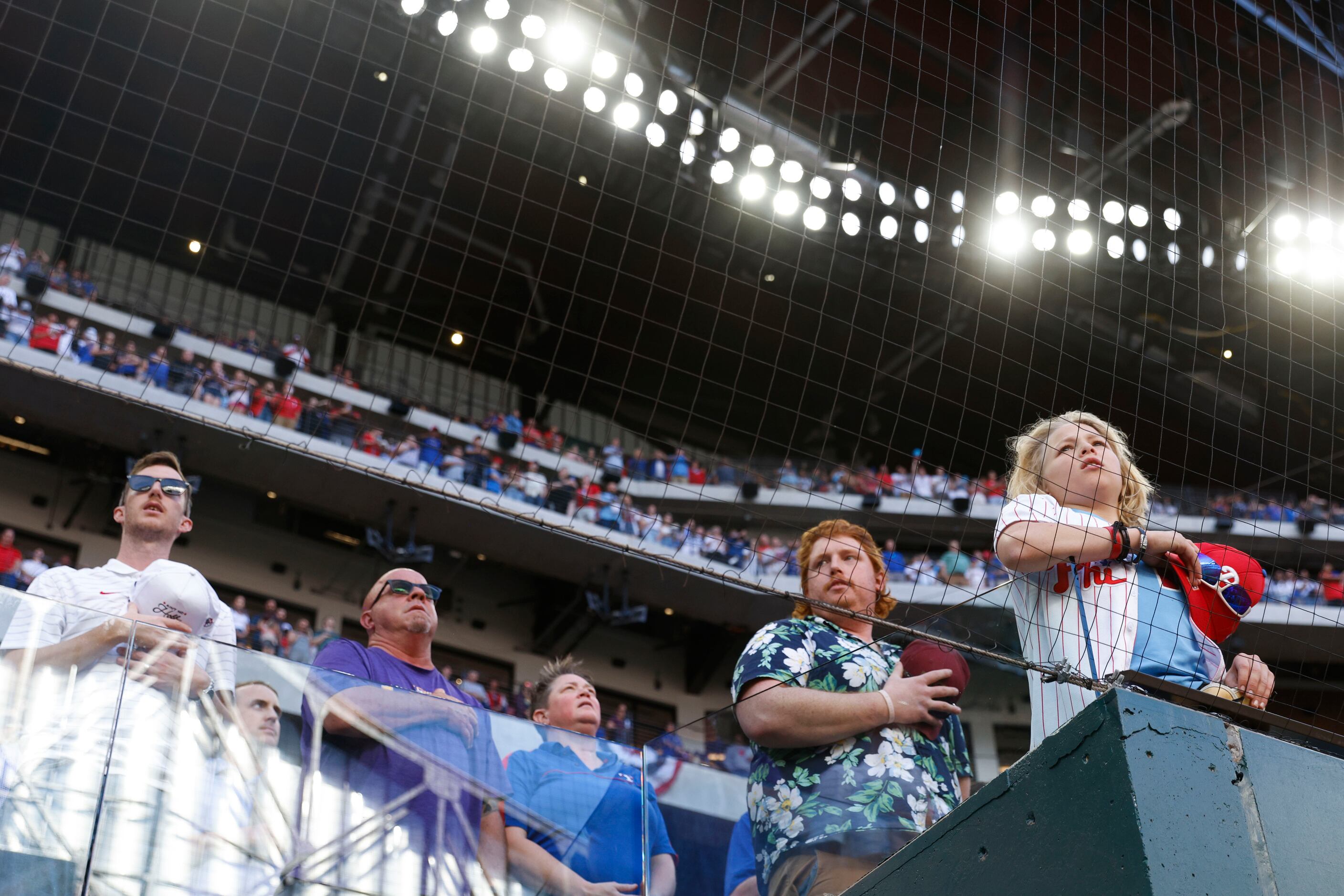 Crowds stand during a baseball game against Philadelphia Phillies at Globe Life Field on...
